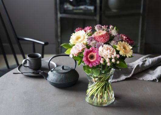 bukett i glassvase
